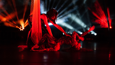 Dancers wrapped in a net