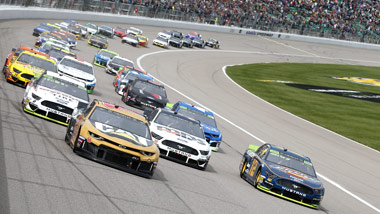 cars on racetrack at Kansas Speedway